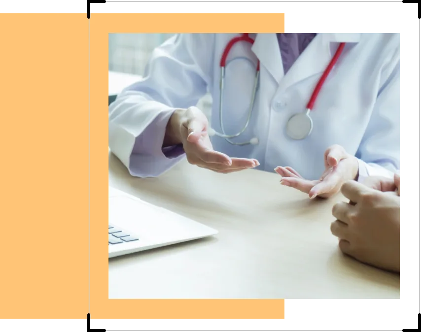 Doctor explaining options to a patient across a desk
